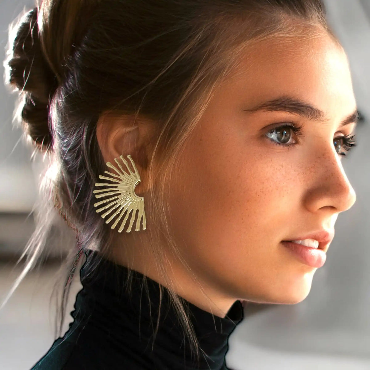 Golden sunburst earring.