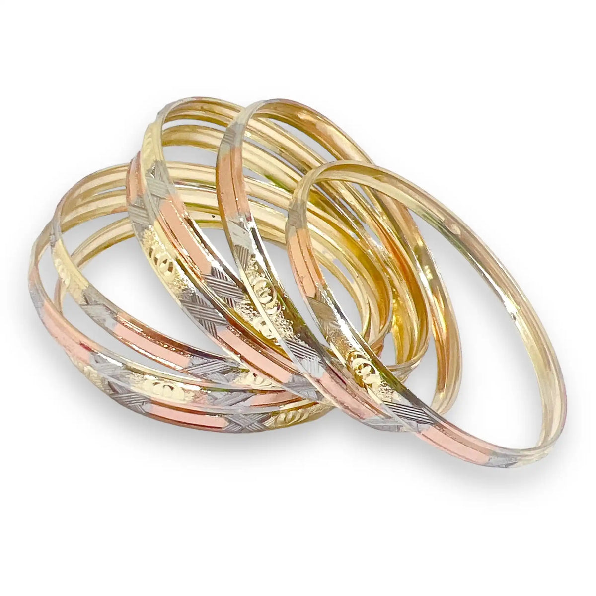 Stack of tri-color gold bangles.