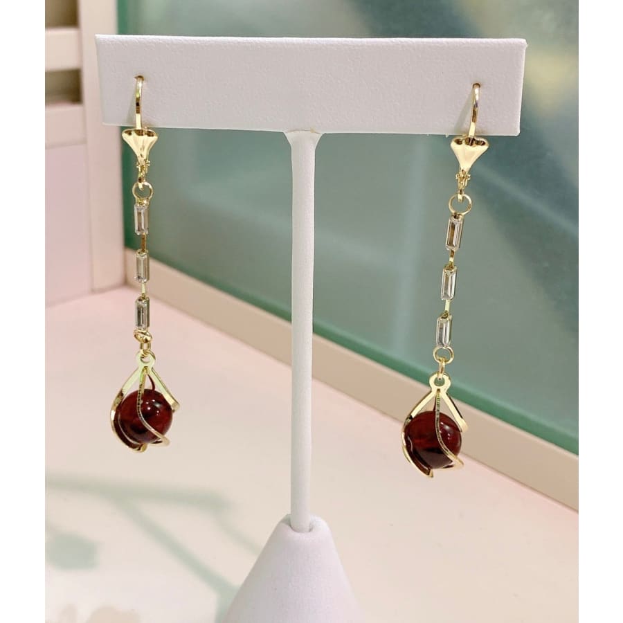 Red ball cz earring in 18k of gold plated