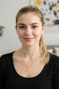 F. Off cow tag gold plated pendant - necklace.