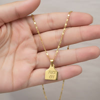 F. Off cow tag gold plated pendant - necklace.