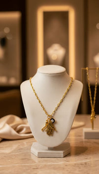Mística hamsa hand evil eye horn necklace in 14k of gold layered chains