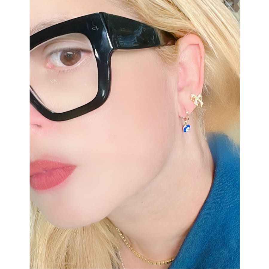 Dainty’s 5mm dark blue evil eye huggies earrings